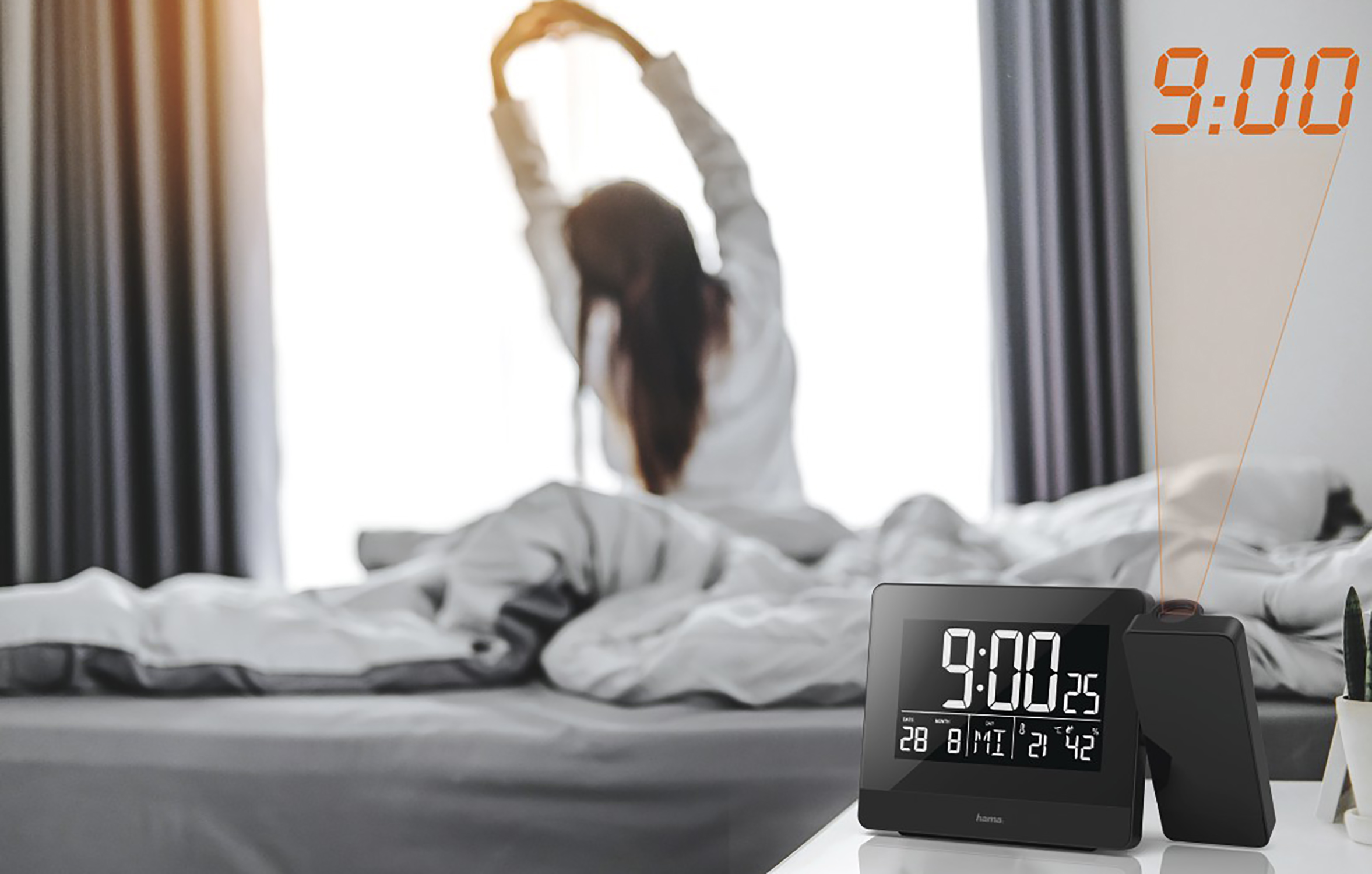 Alarm clock showing 9:00.