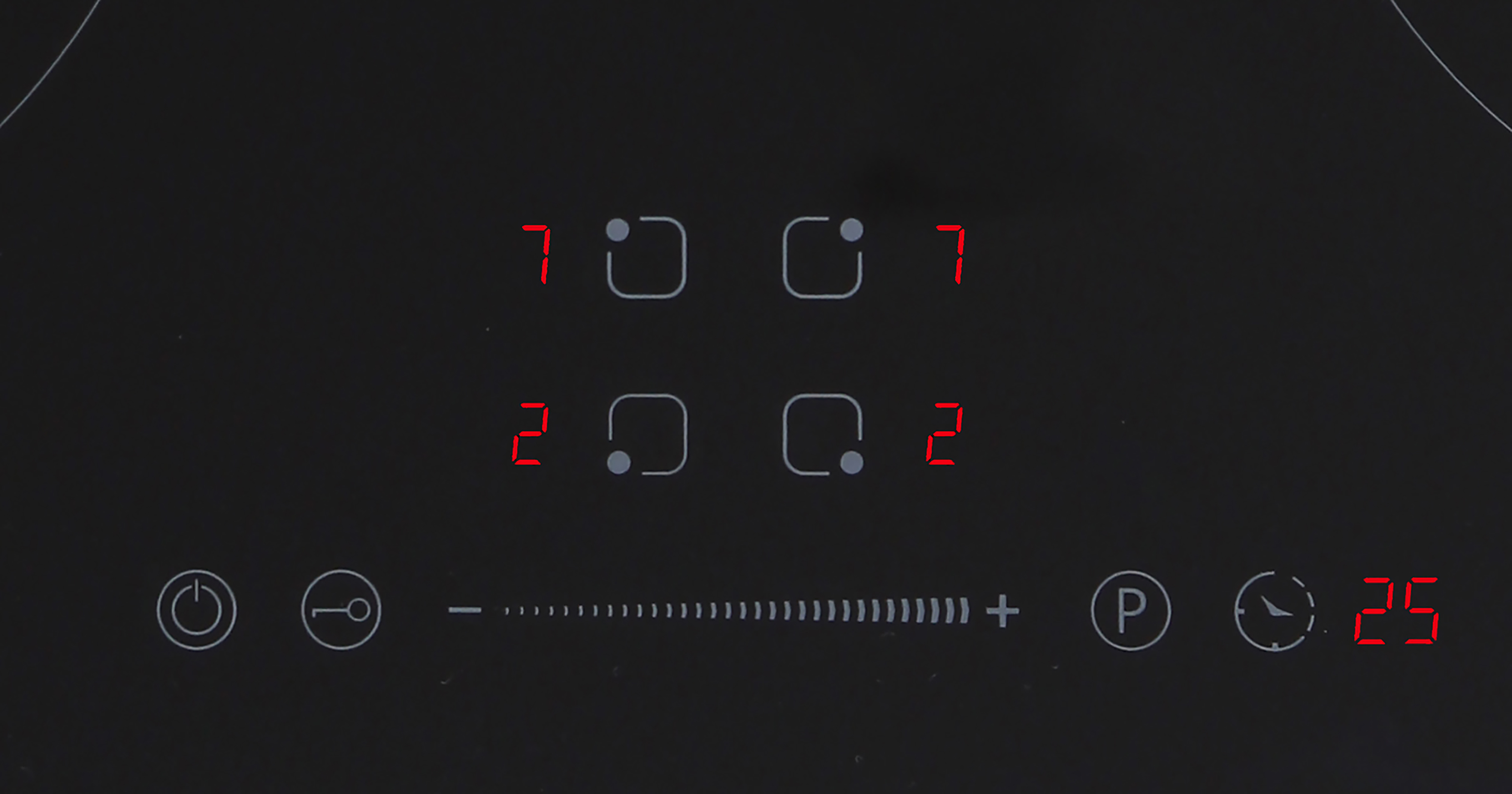 Black cooktop with touch controls and red illuminated circles.