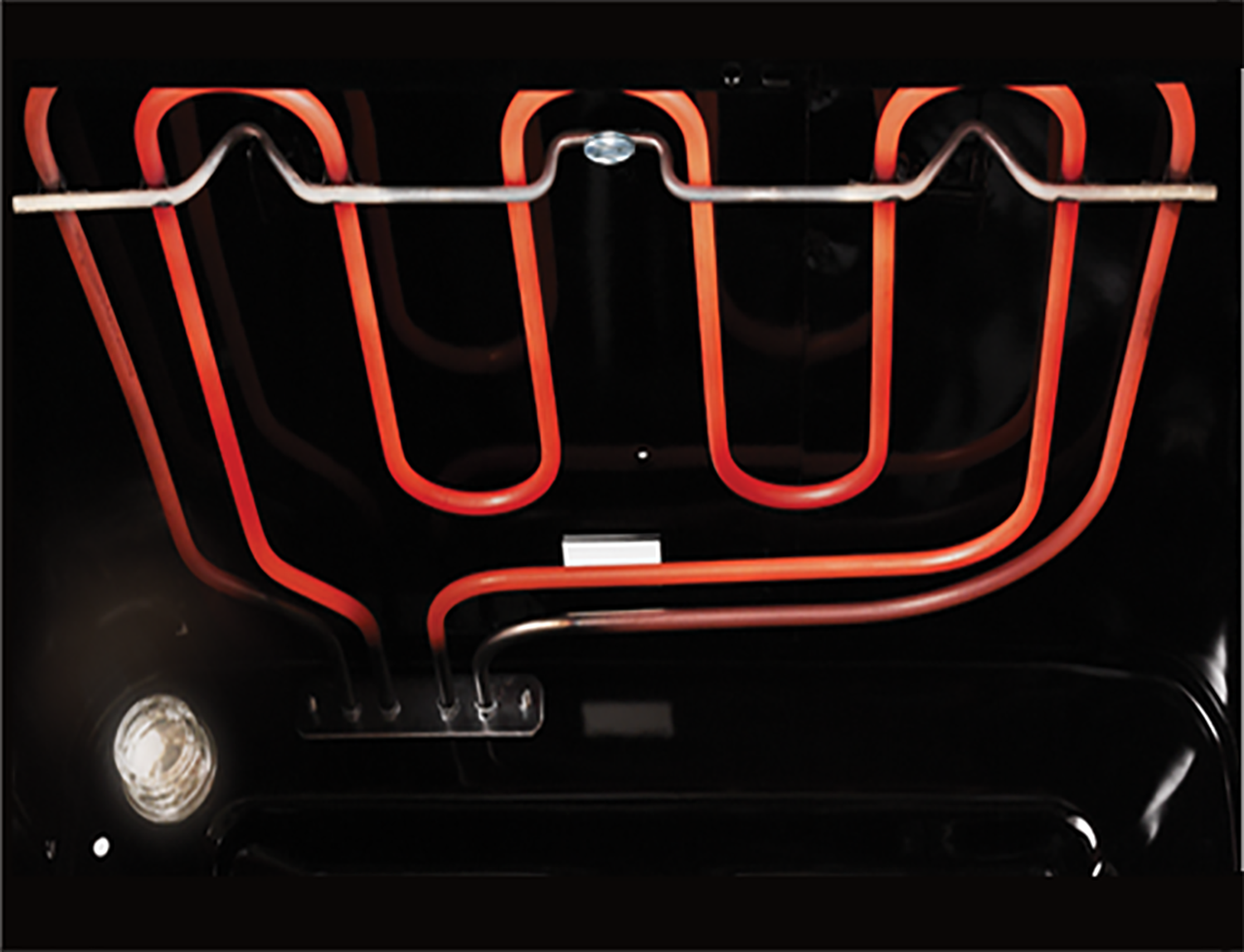 The inside of an oven with glowing red heating elements.
