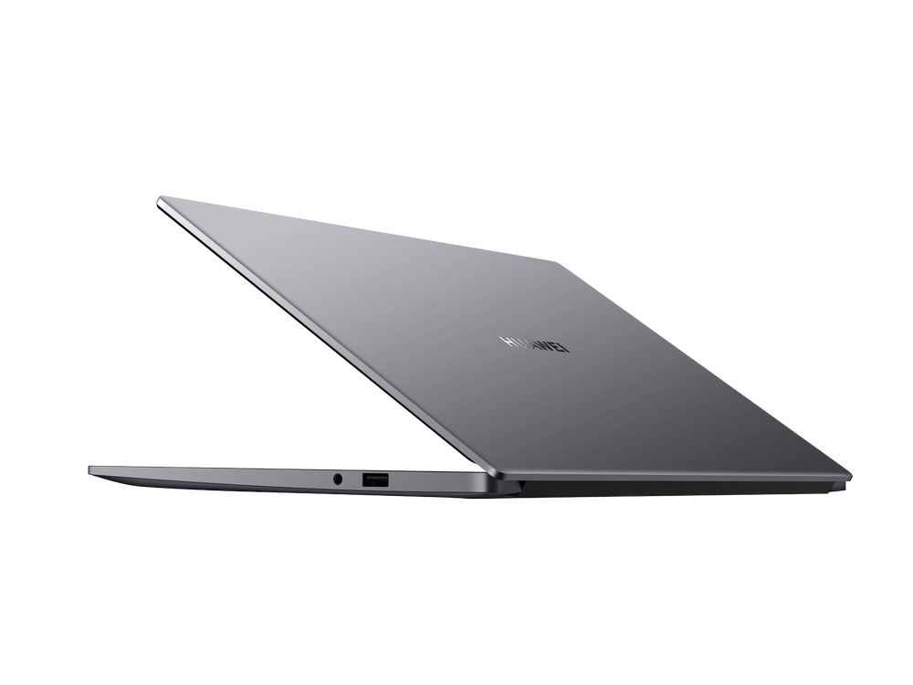 Un portátil plateado está ligeramente abierto, mostrando el logo de Huawei.