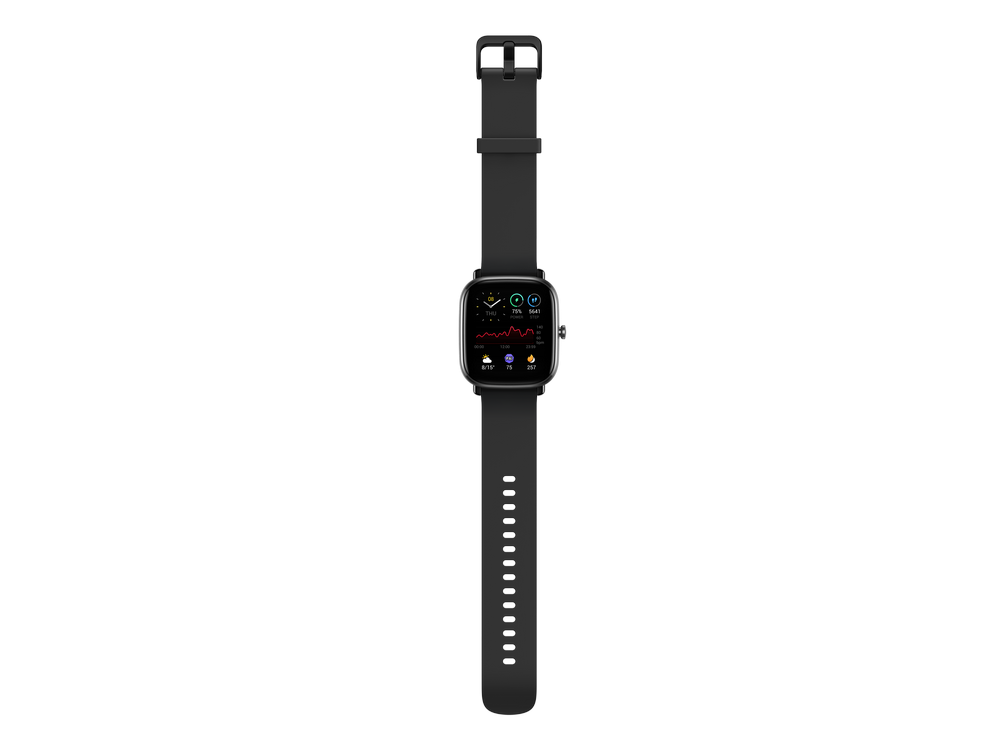 Smartwatch negra con pantalla que muestra datos de frecuencia cardíaca y actividad, sobre fondo gris.
