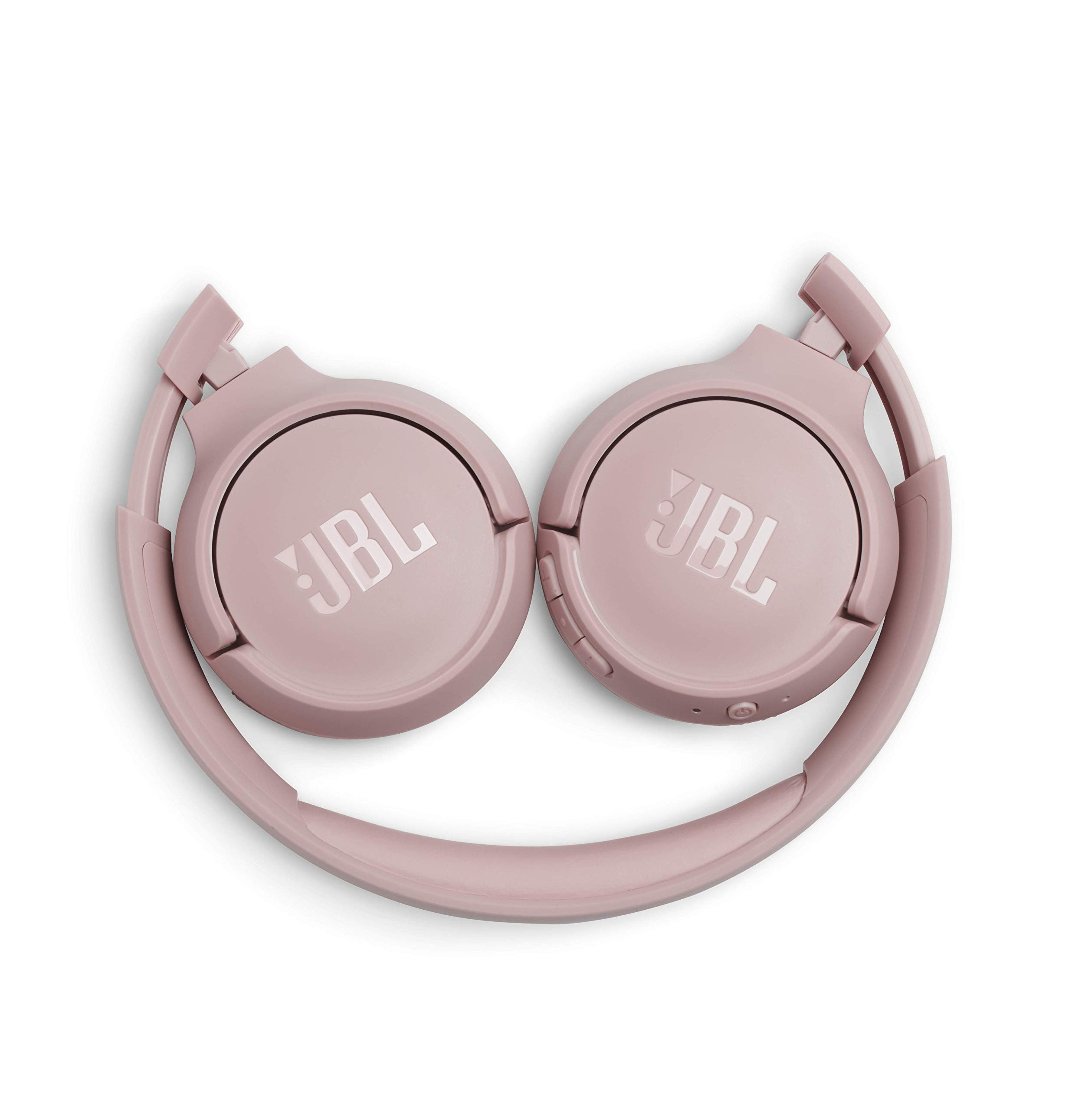 Beyaz bir yüzeyde katlanmış pembe JBL kablosuz kulaklıklar.