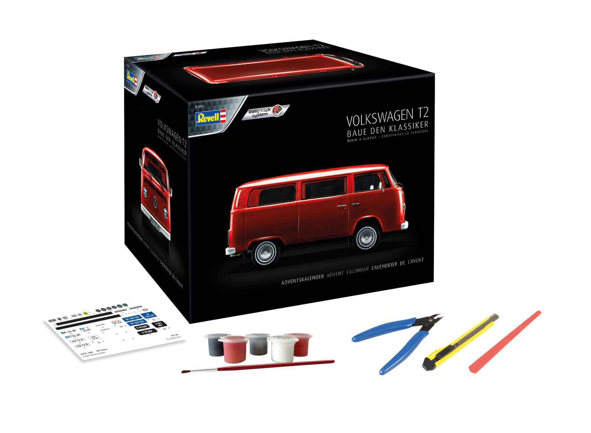 Box eines VW T2 Modellbausatzes. Rotes Van-Bild mit Text auf der Box. Werkzeuge sind vorhanden.