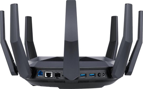 Black router with antennas, ports, and buttons, on a white background.