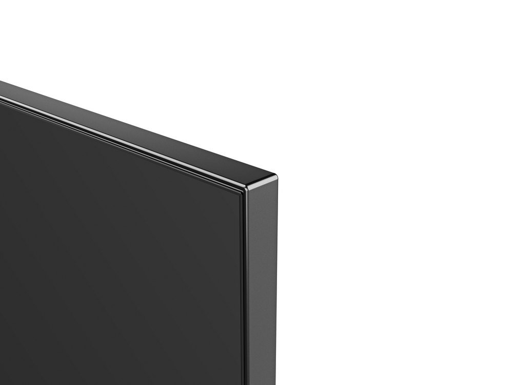 Primer plano de una esquina de pantalla negra brillante sobre fondo blanco.