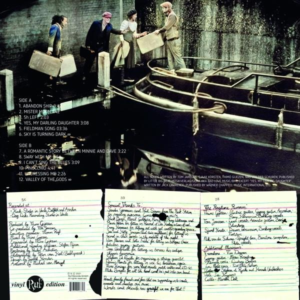 Rückseite einer Schallplatte mit Songtiteln und Credits auf Papier geschrieben.