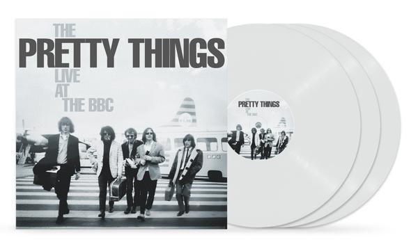 Ein Vinyl-Albumcover und drei weiße Vinyl-Schallplatten sind sichtbar.