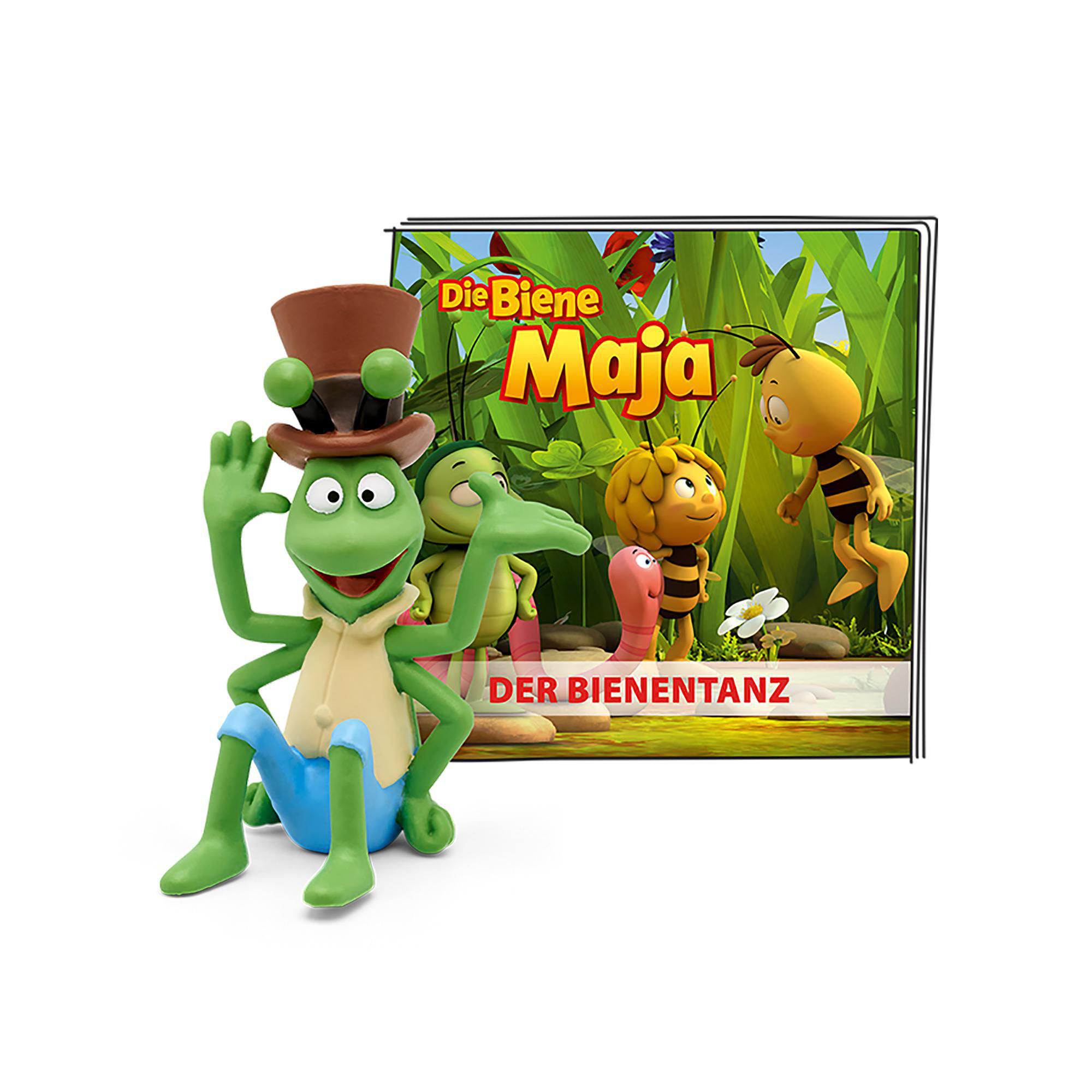 Eine grüne Heuschrecke mit Hut sitzt, mit einem Buch und Zeichentrickfiguren.