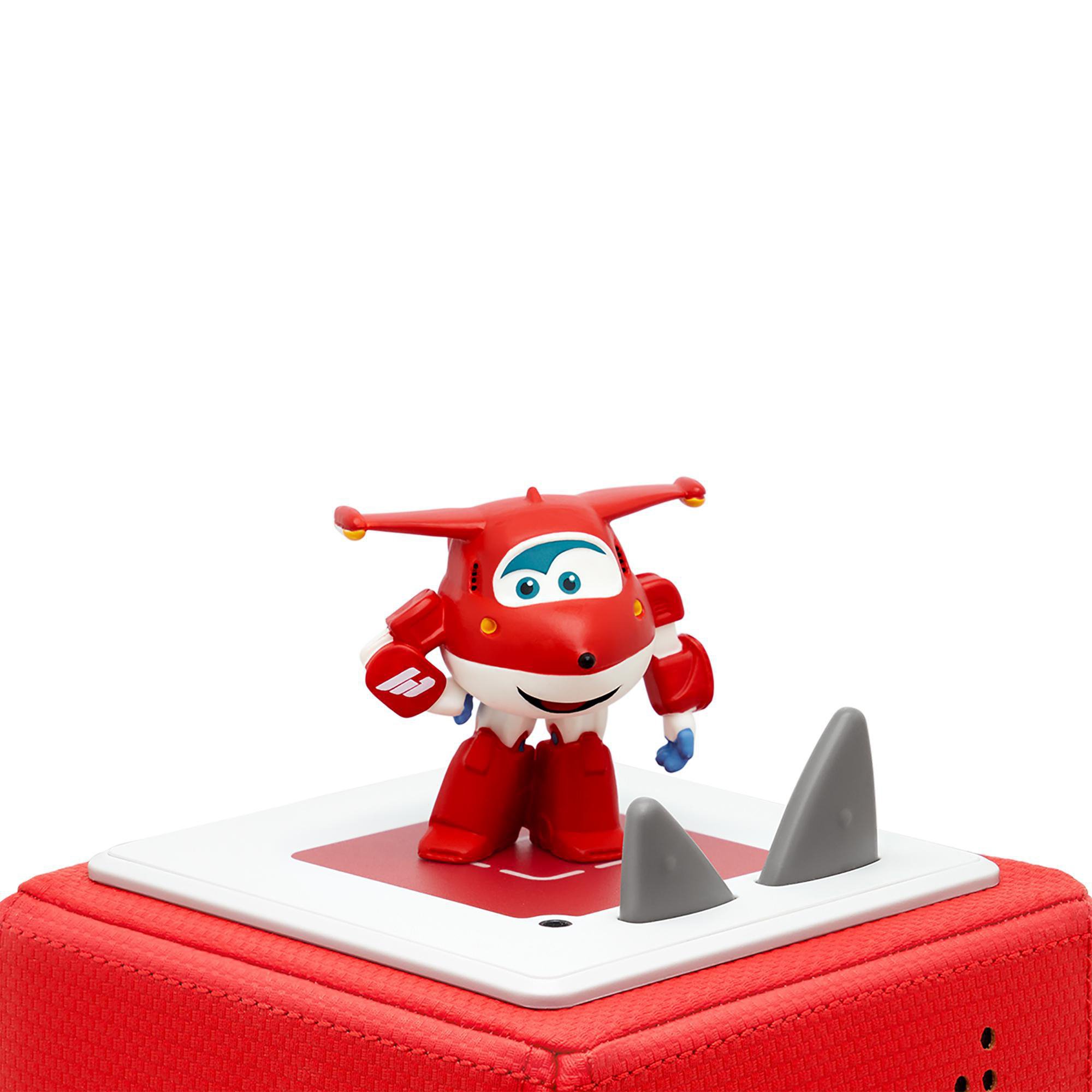 Roter Super Wings Spielzeugroboter steht auf roter Basis mit grauen Haiflossen. Weißer Hintergrund.