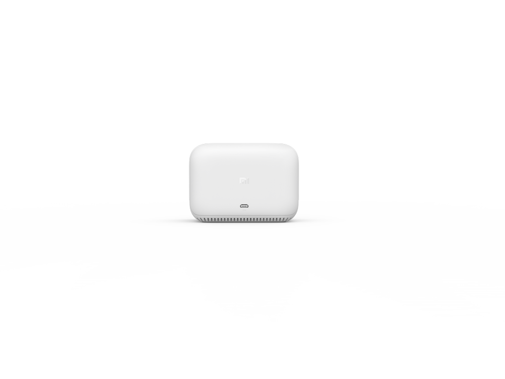 Dispositivo blanco, rectangular, pequeño, centrado, con un puerto, sobre fondo blanco.