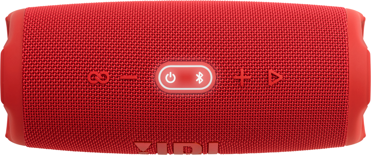 Red JBL speaker, buttons visible. The speaker is rectangular with rounded edges. The surface is textured.