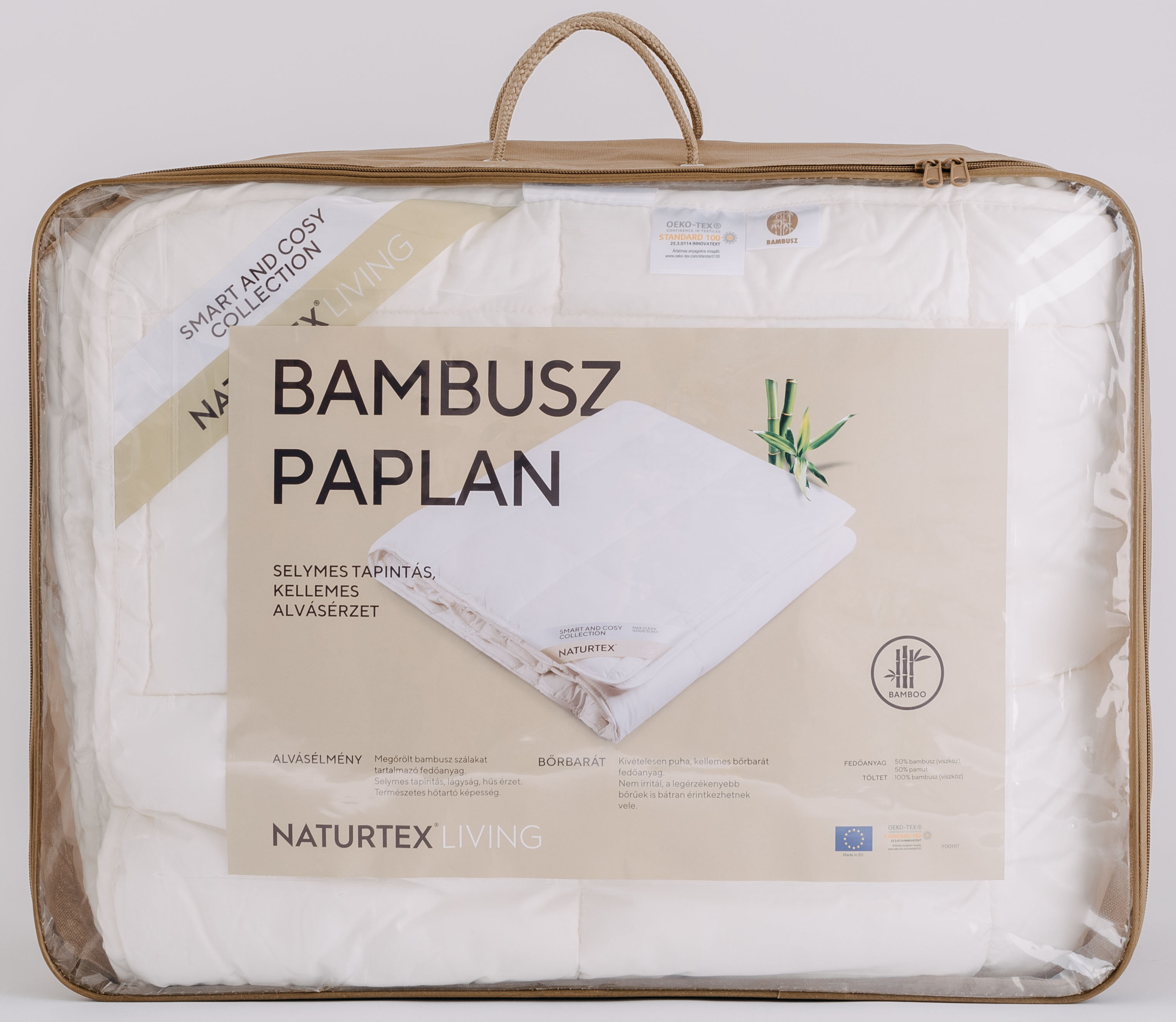 Nagy, átlátszó műanyagba csomagolt paplan. A csomagoláson szöveg és bambusz illusztráció található.
