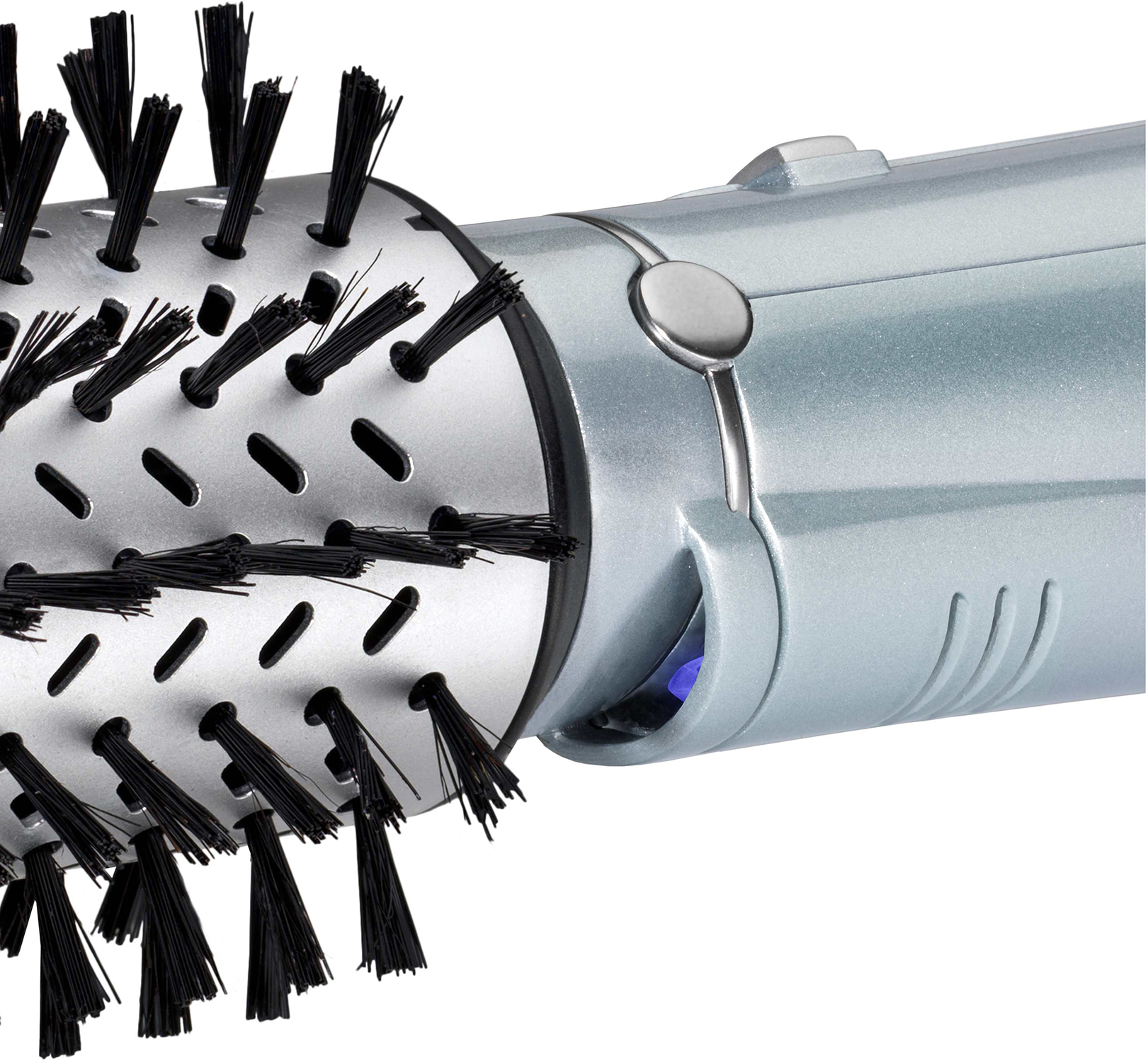 Close-up of a hairbrush with black bristles and a silver body.