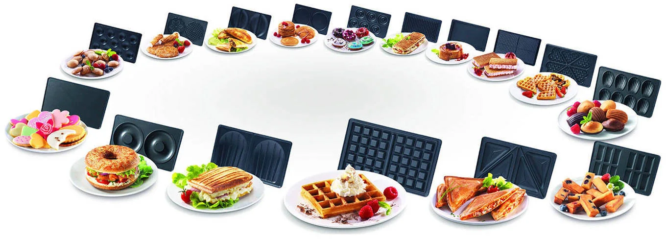 Varietà di cibi serviti su piatti, come waffle, ciambelle, panini e waffle.