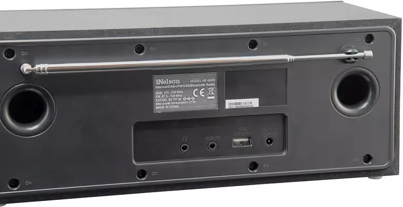 Back view of a black Nelson radio, with antenna and connector ports visible.