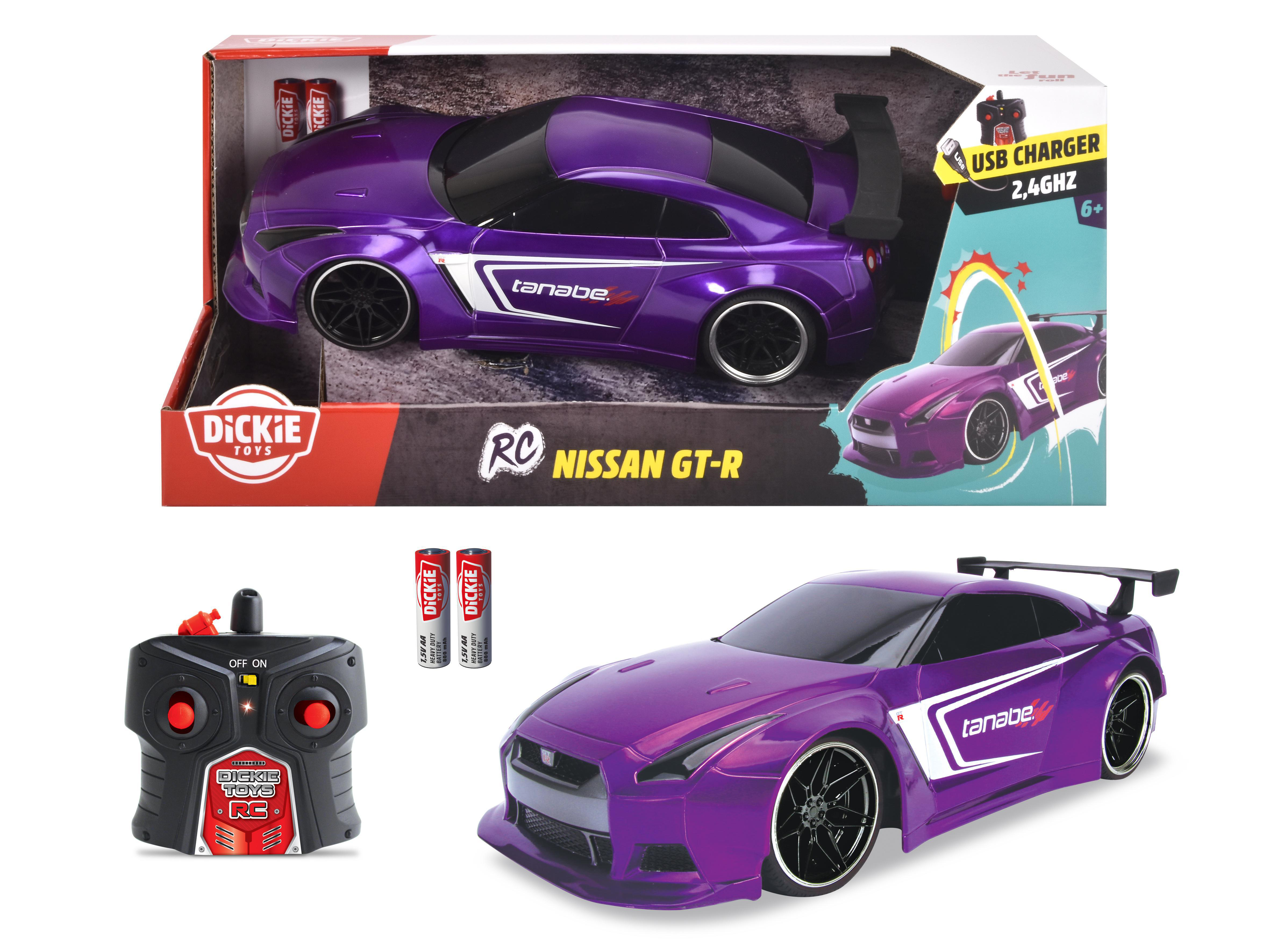 Ein lila Spielzeugauto mit schwarzem Spoiler und schwarzen Felgen. Eine Fernbedienung und Batterien sind ebenfalls vorhanden.