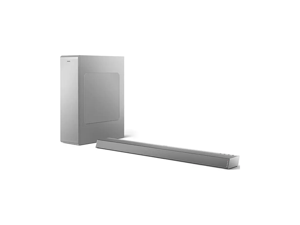 Un conjunto de barra de sonido y subwoofer, gris, sobre fondo blanco, diseño minimalista.
