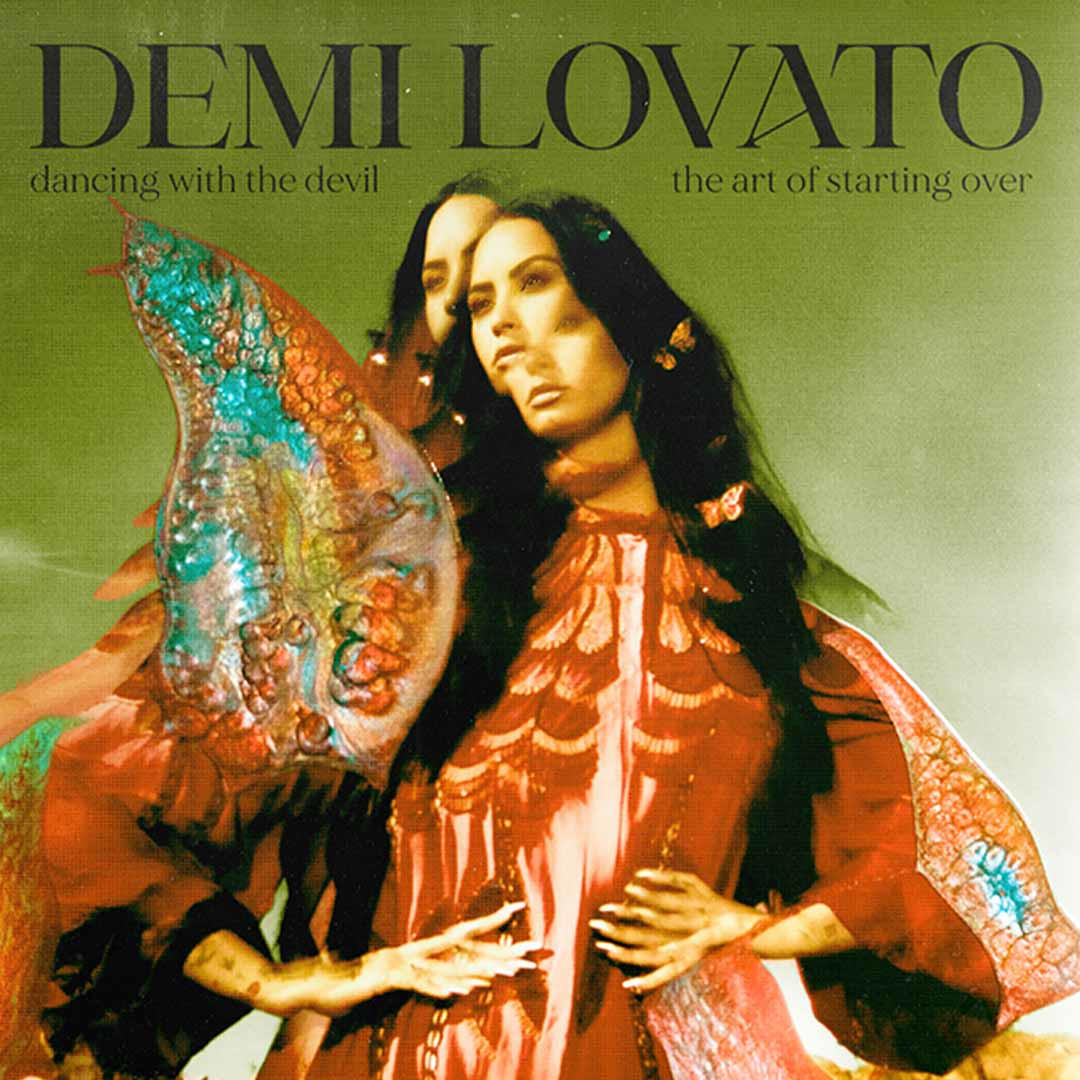 Album borító. Két hosszú hajú nő. Szöveg: Demi Lovato, dancing with the devil.