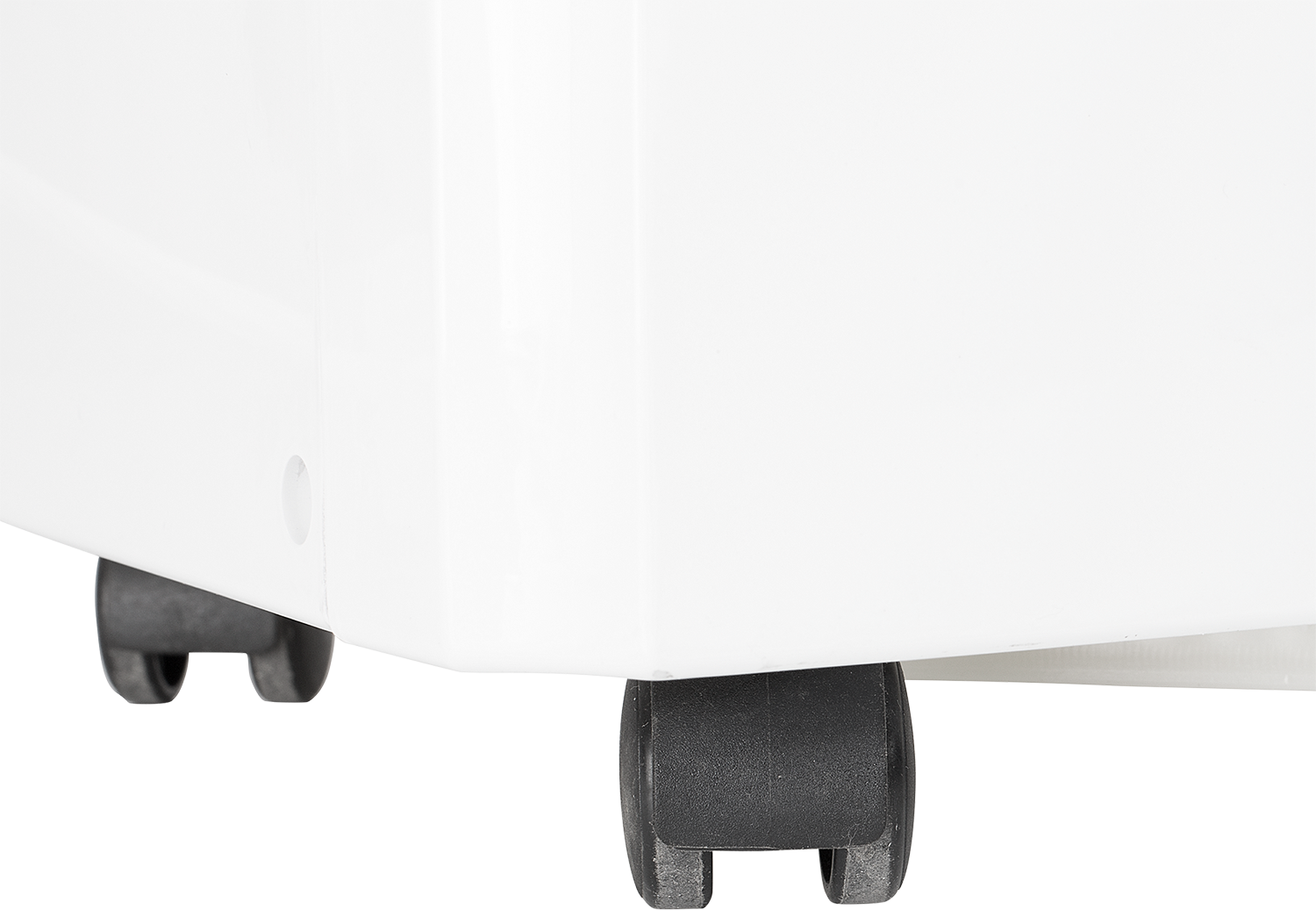 Close-up of a white cabinet corner with two black wheels. The background is black.