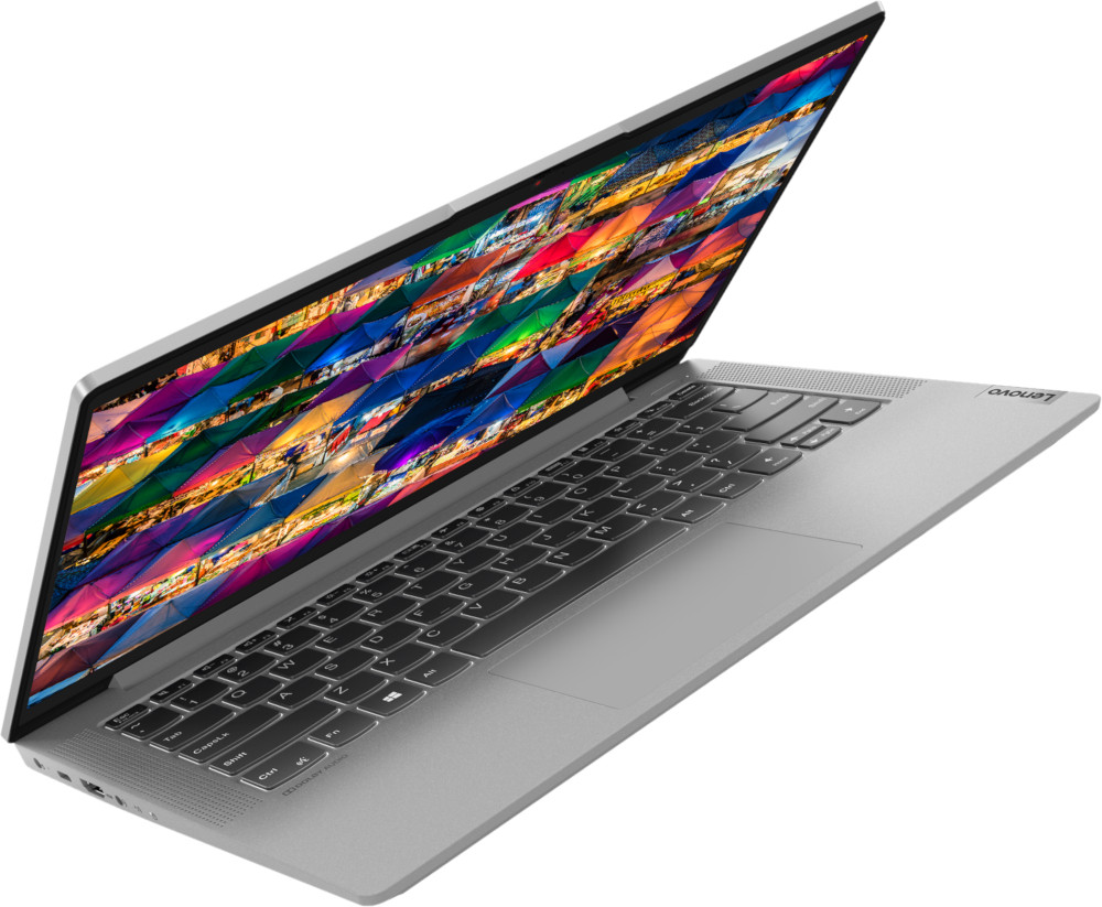 Ordinateur portable Lenovo argenté. L'écran affiche une image abstraite colorée. Le clavier est visible.