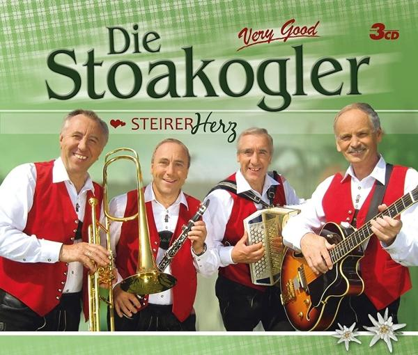Eine Gruppe von vier Männern in traditioneller österreichischer Tracht mit Instrumenten.