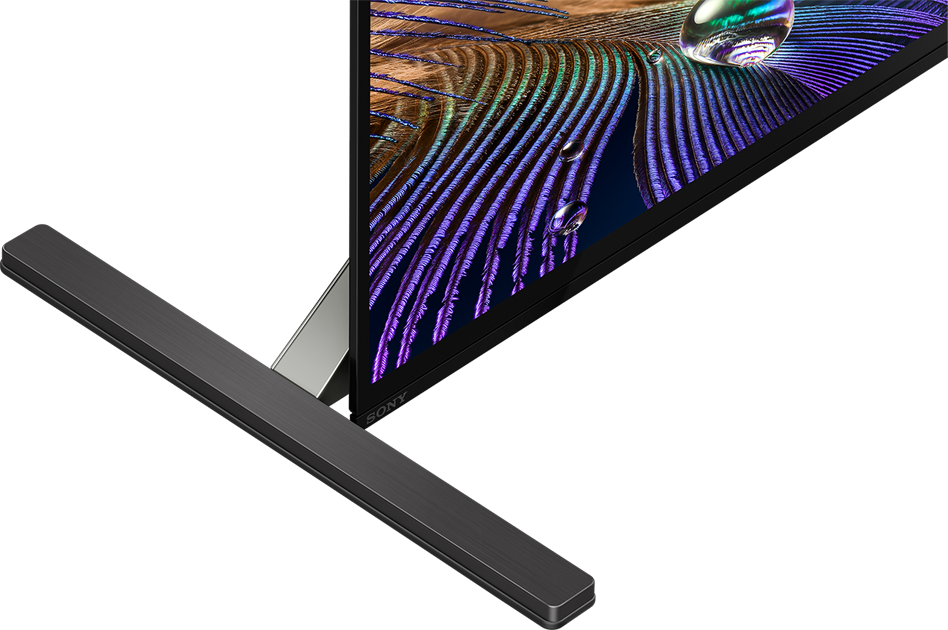 Schermo TV nero con soundbar. Il display mostra colori vivaci.