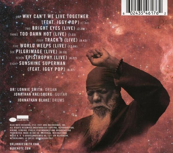 Albumcover mit Text und einem Mann mit Bart und erhobener Faust. Rot und Schwarz.