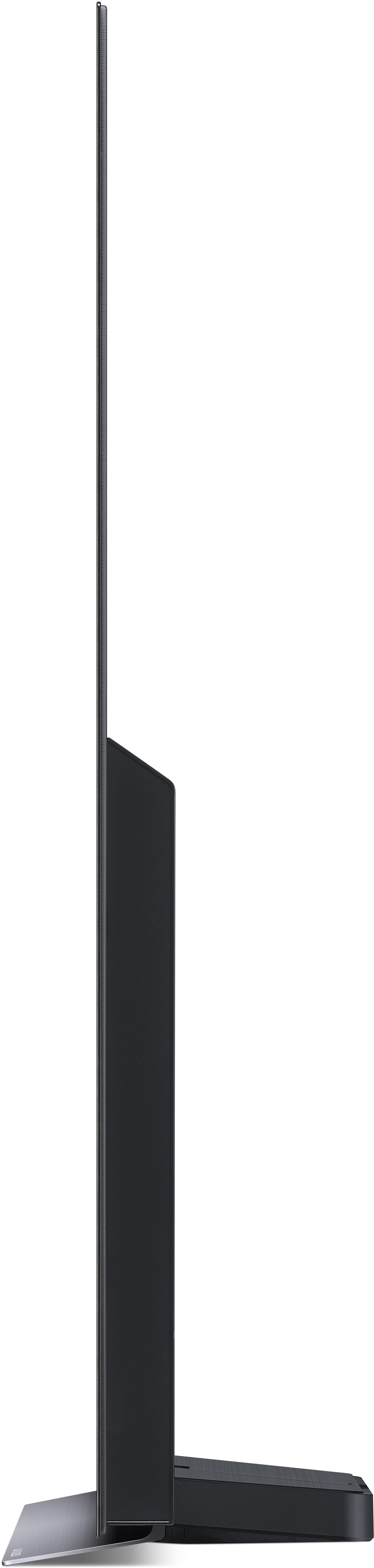 Seitenansicht eines LG OLED-Fernsehers. Der Bildschirm ist schwarz, der Fernseher steht auf einem Ständer.