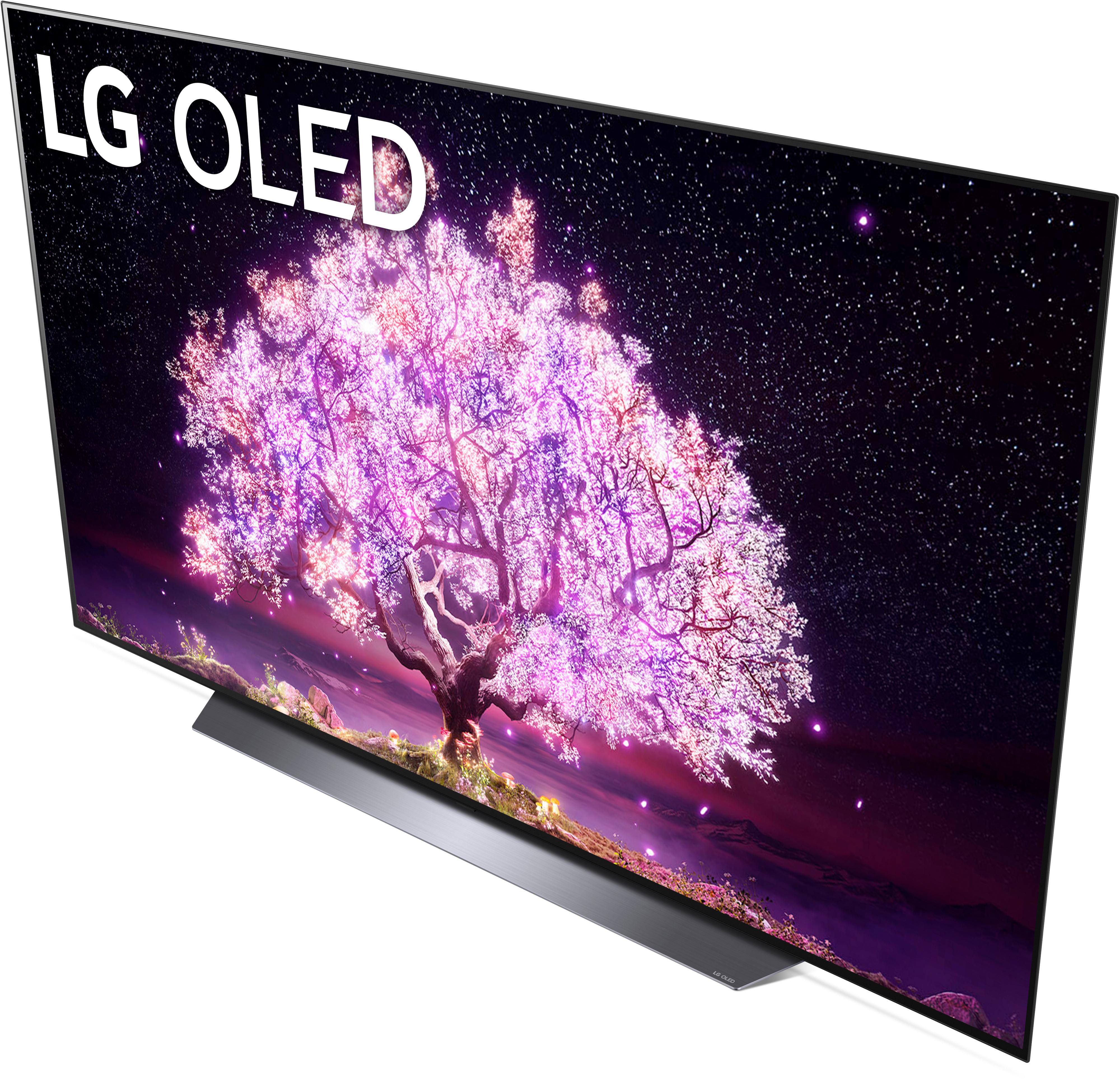 LG OLED-Fernseher, der einen Sternenhimmel mit einem Baum mit rosa Blüten zeigt.