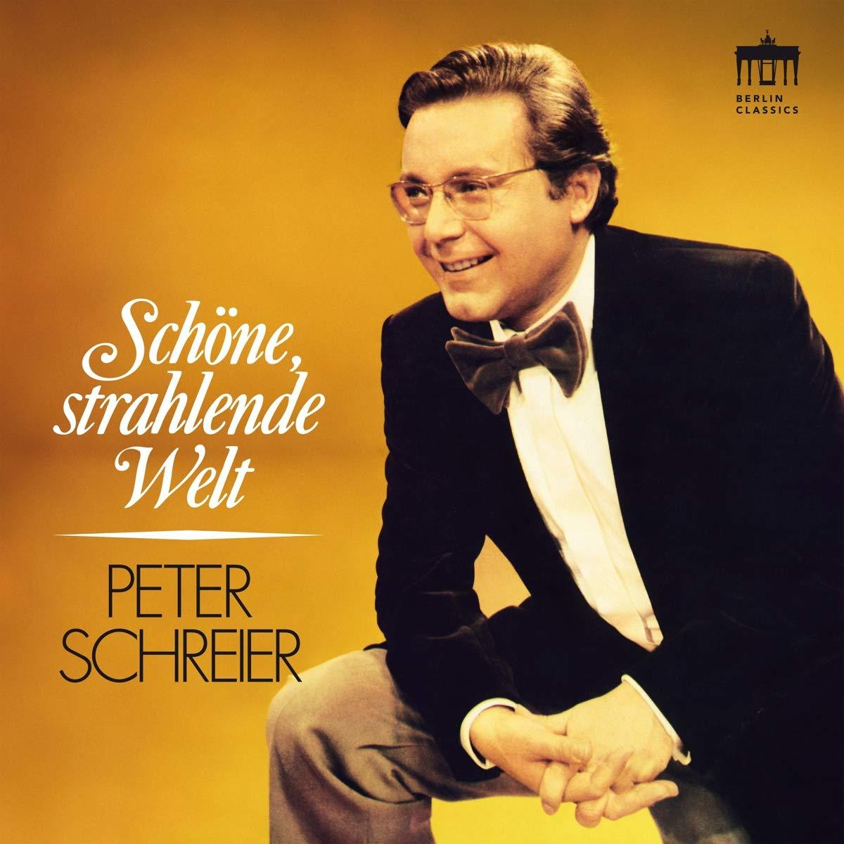 Albumcover mit einem Mann im Anzug, der lächelt, mit dem Text 'Schöne, strahlende Welt'.