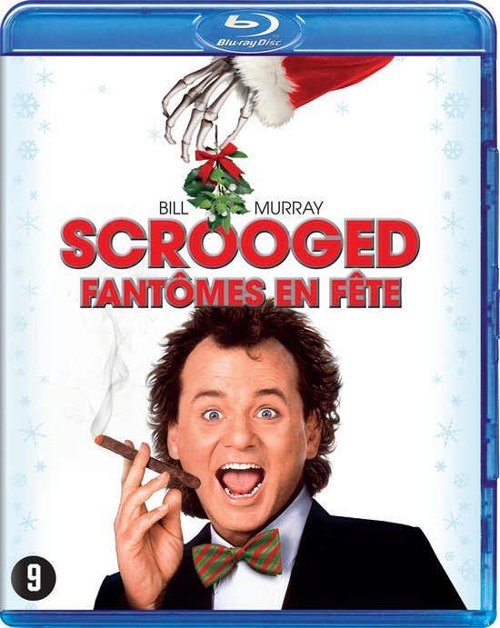 Blu-ray-hoes: Bill Murray, lachend met sigaar, skelet hand houdt maretak. Titel: Scrooged.