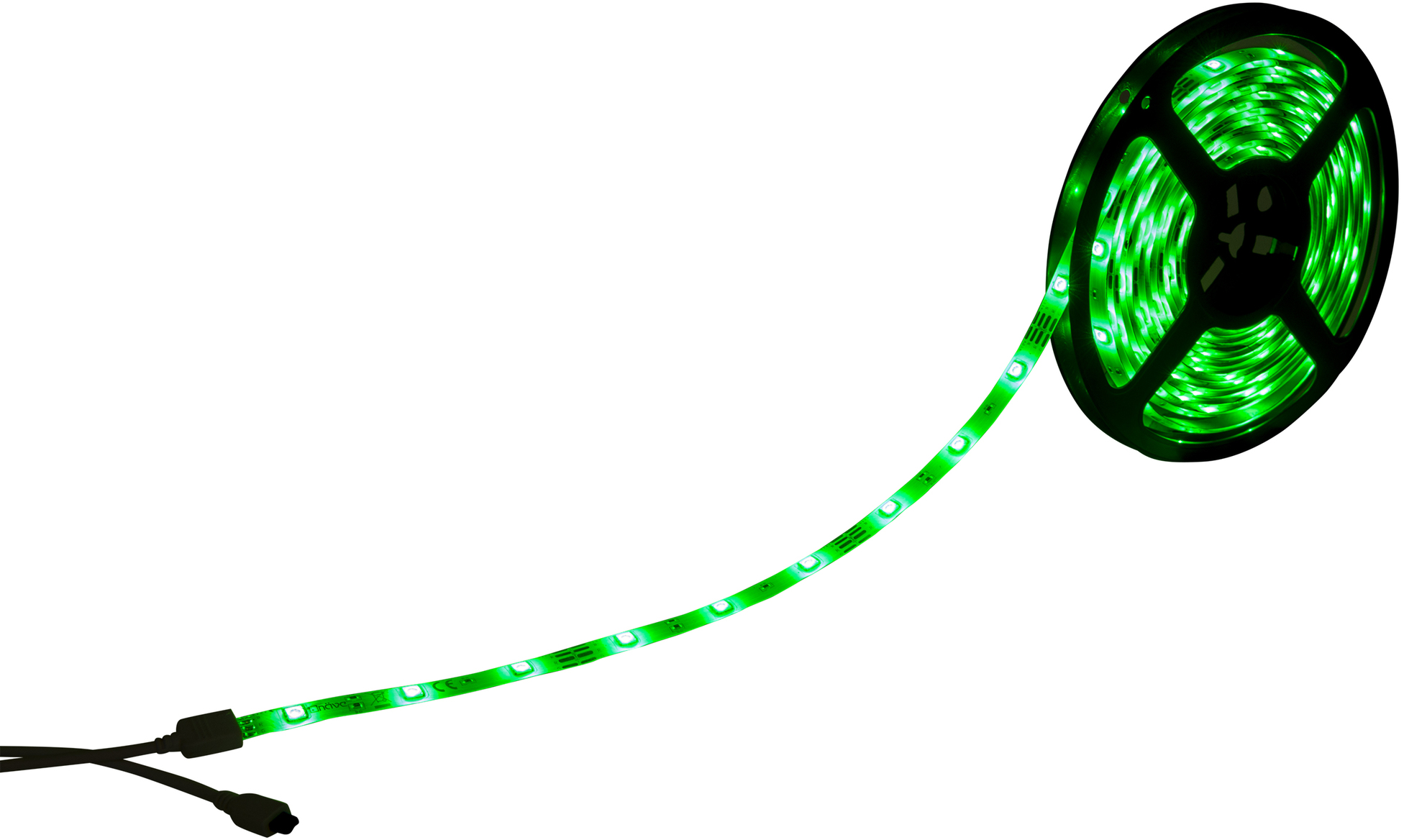 Striscia luminosa a LED verde su sfondo bianco. La luce è accesa. La striscia è su una bobina nera.