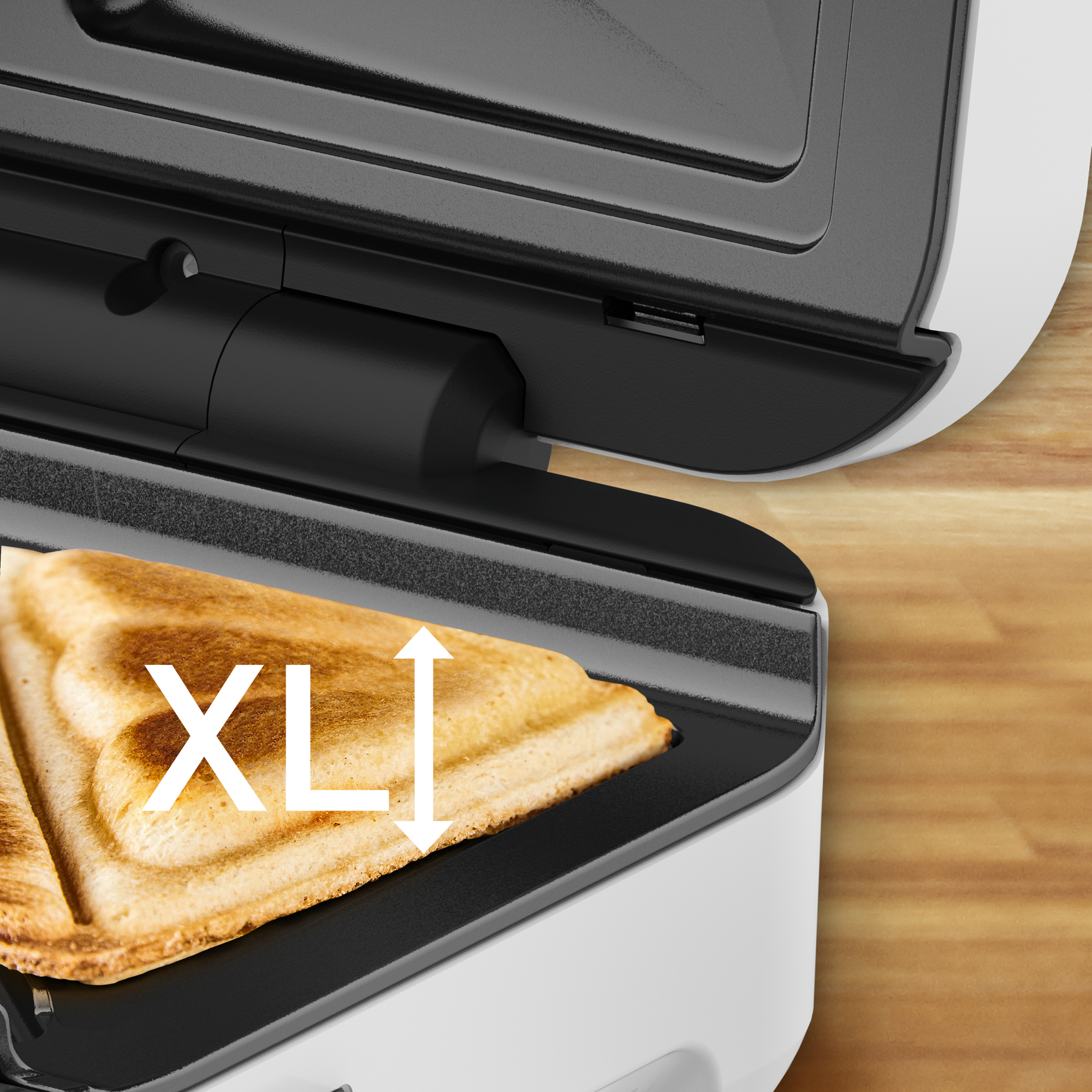 A sandwich toaster with a toasted sandwich. The word 'XL' is written on the sandwich.