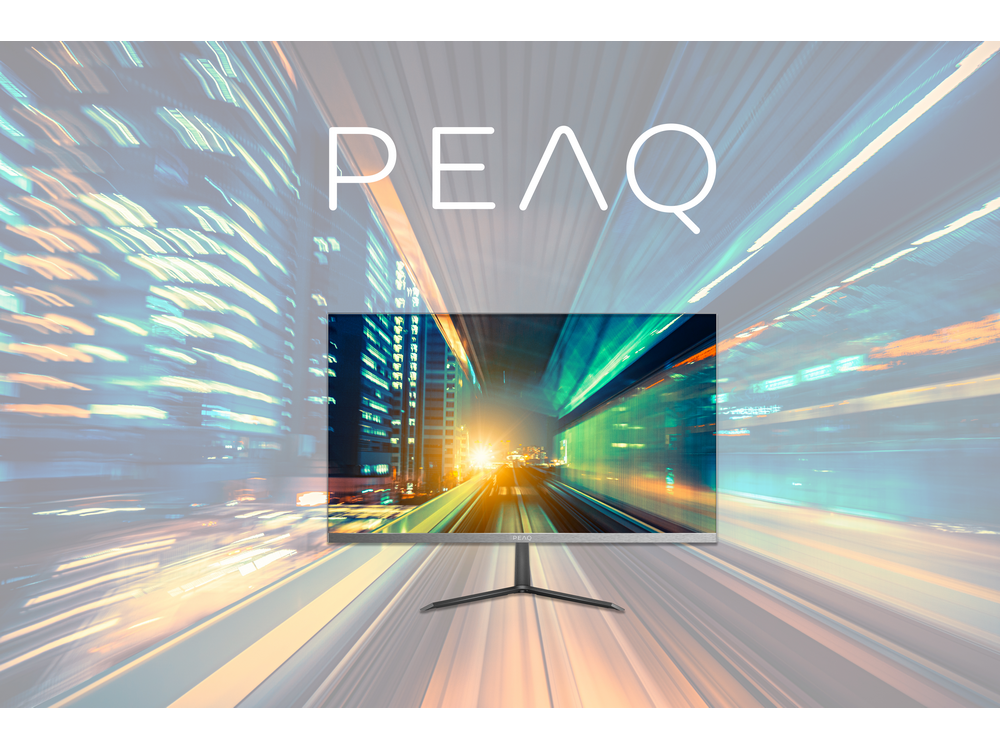 Monitor PEAQ contra un fondo borroso de luces y una carretera.