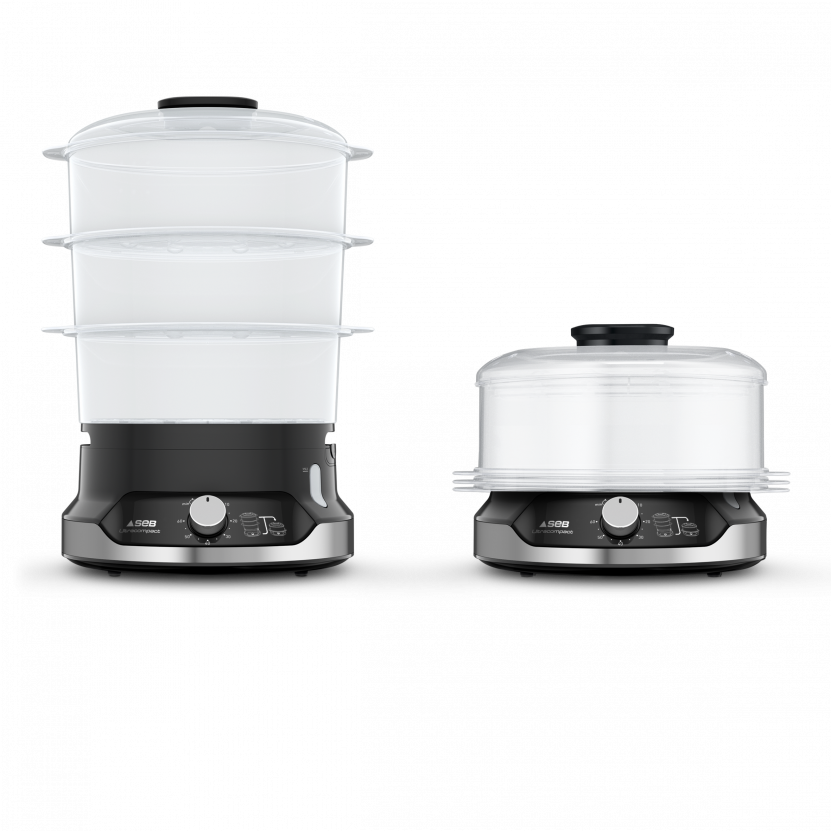 Two food steamers, one assembled with all tiers, the other with a lid on the base.