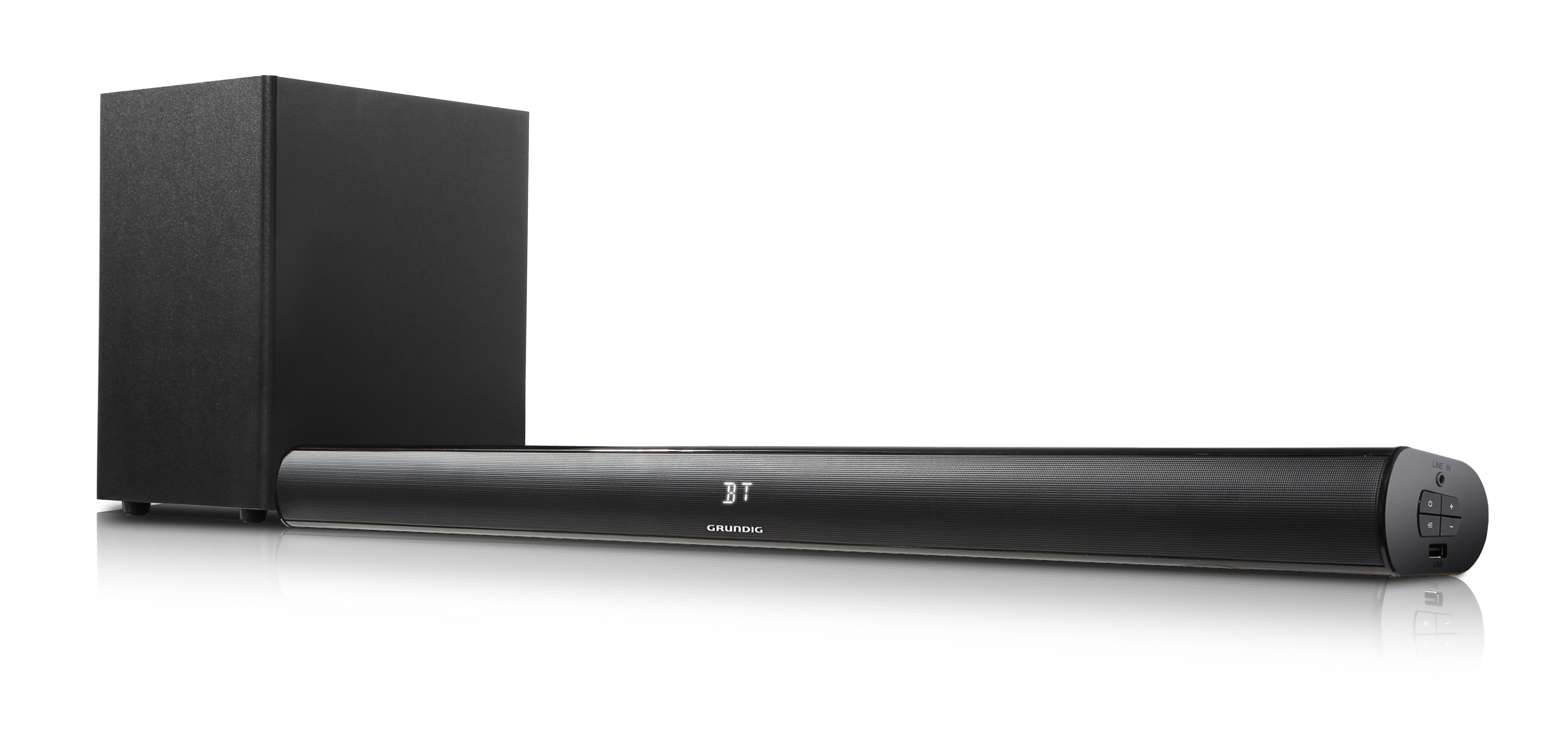 Siyah bir Grundig soundbar, subwoofer'lı. Yansımalarla beyaz bir yüzey üzerinde.