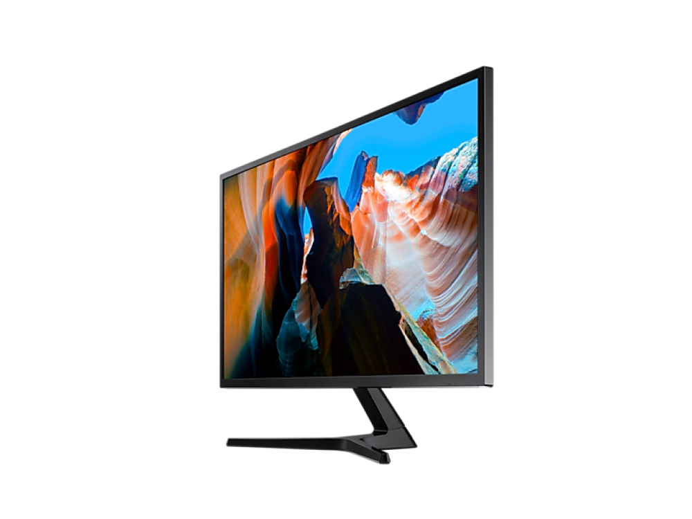 Un monitor de computadora que muestra una escena de cañón con un cielo azul, sobre un fondo negro.