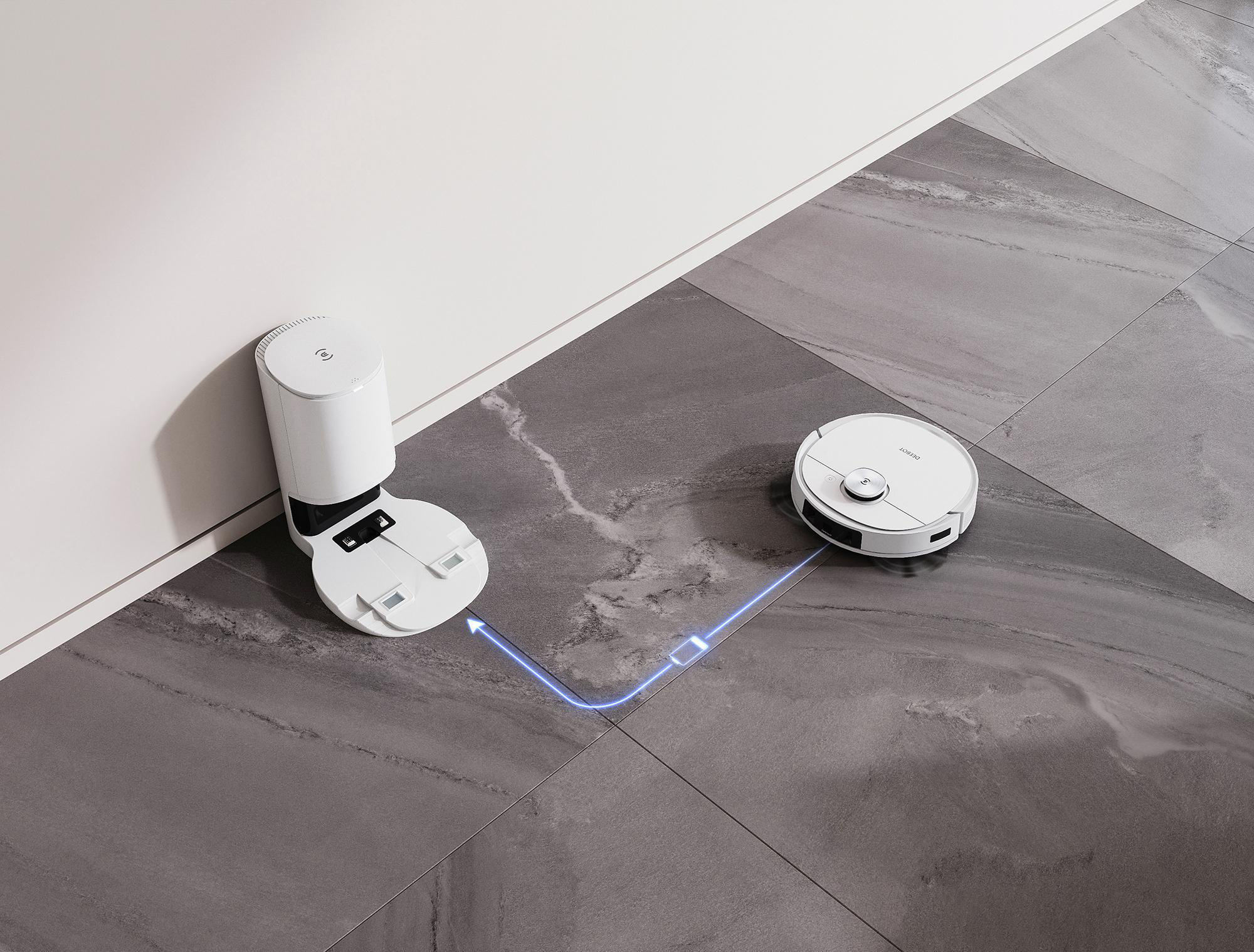 Roboter-Staubsauger mit Ladestation. Der Roboter befindet sich in der Nähe der Station auf grauem Boden.