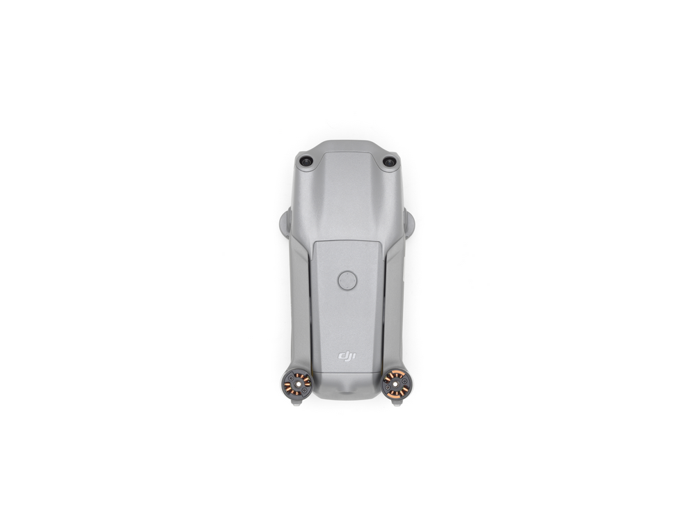 Un dron DJI gris desde arriba, sobre un fondo blanco.