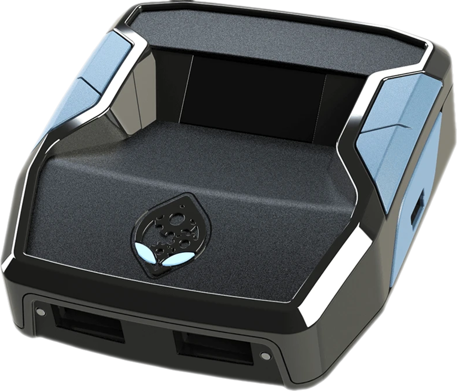 Console de jeu Alienware noire et bleue avec un logo de tête d'alien lumineux et ports USB.