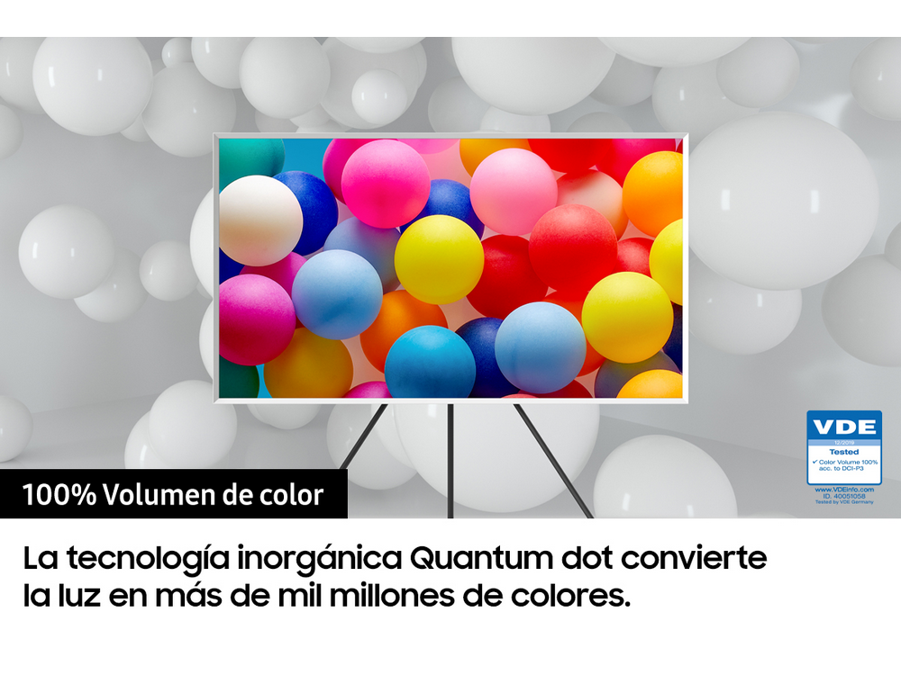 Pantalla de TV que muestra bolas coloridas, con texto que indica el 100% de volumen de color y tecnología Quantum dot.