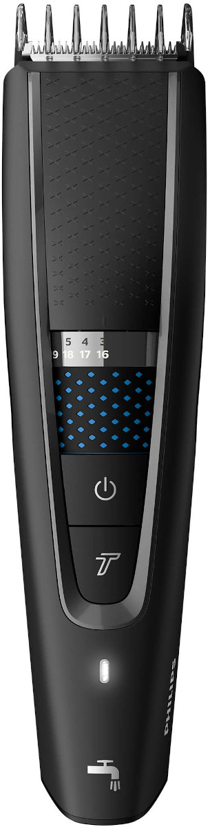 Black electric beard trimmer with a digital display and adjustable settings.