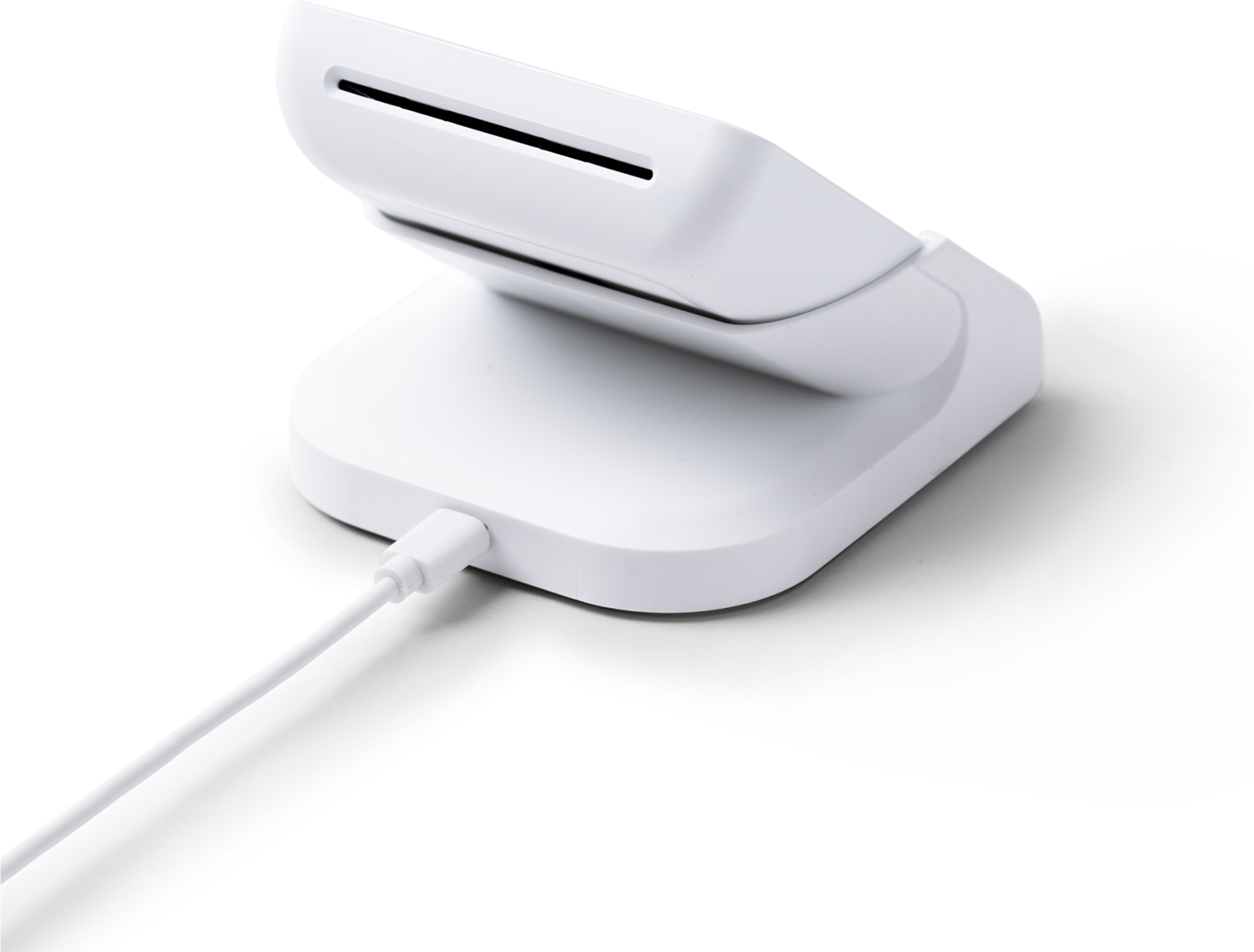 White card reader on a stand with a charging cable connected.