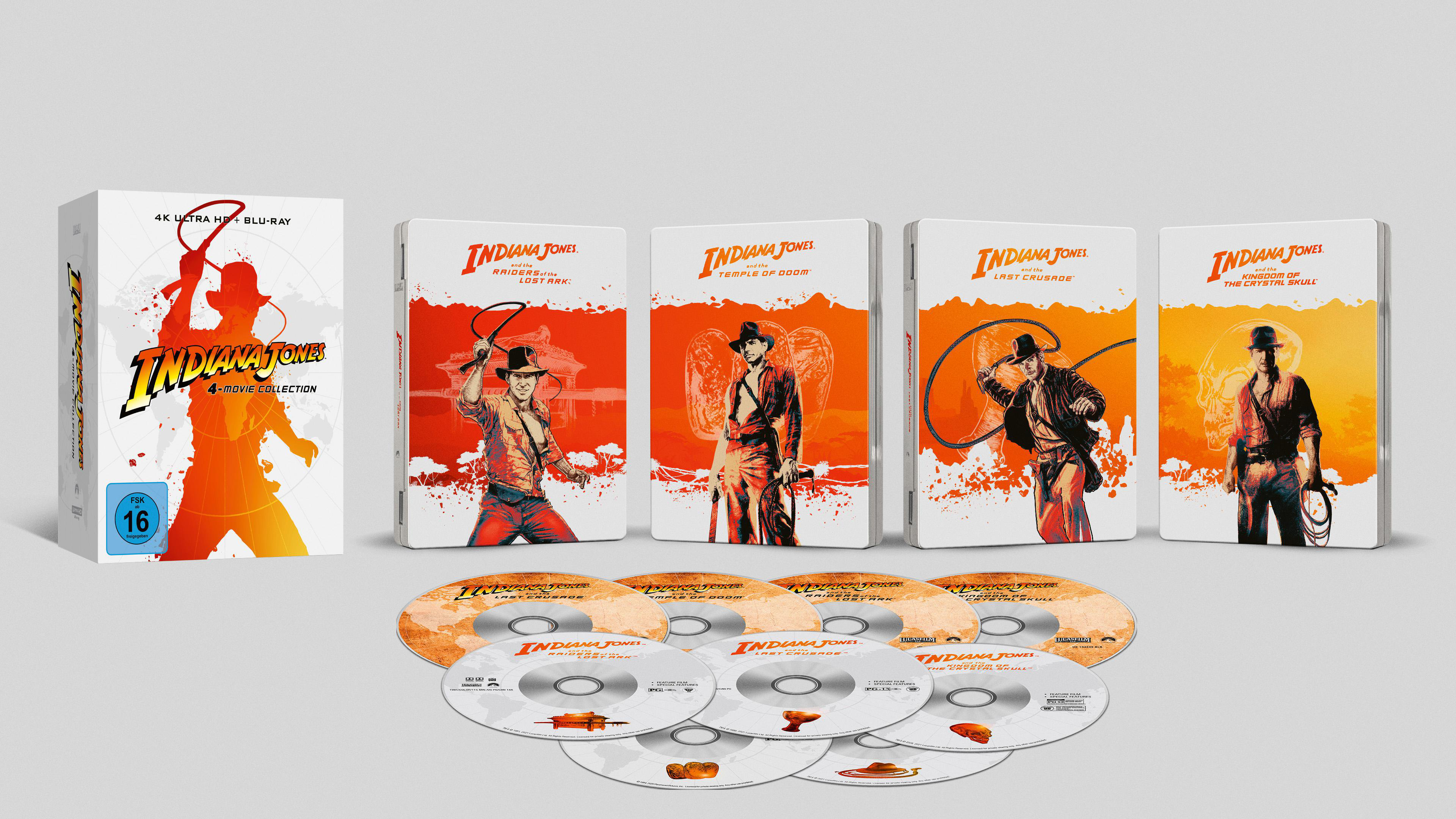 Sammlung von Indiana Jones Filmen auf Blu-ray und DVD. Die Boxen sind auf einer weißen Oberfläche angeordnet.