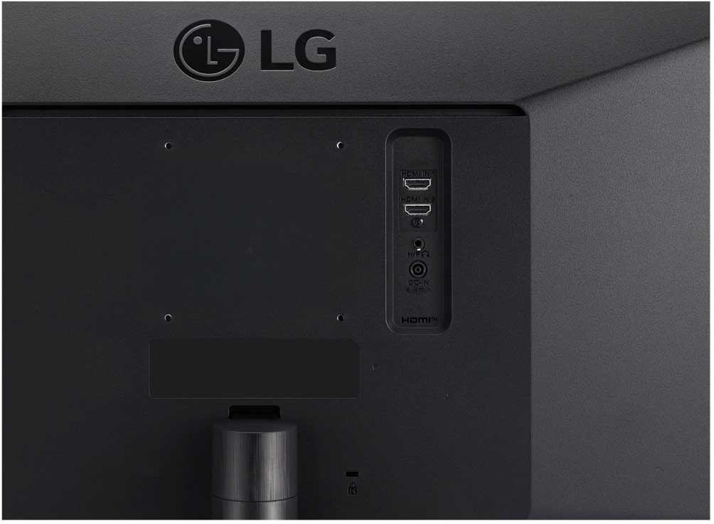 Arrière d'un moniteur d'ordinateur noir avec ports de connexion.