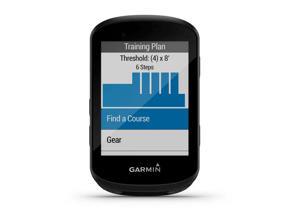 Dispositivo Garmin negro que muestra "Plan de entrenamiento" con opciones de curso. Fondo blanco.
