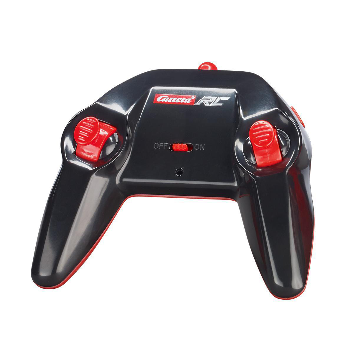 Schwarze Carrera RC Spielzeugauto-Fernbedienung. Rote Knöpfe und Akzente. Weißer Hintergrund.