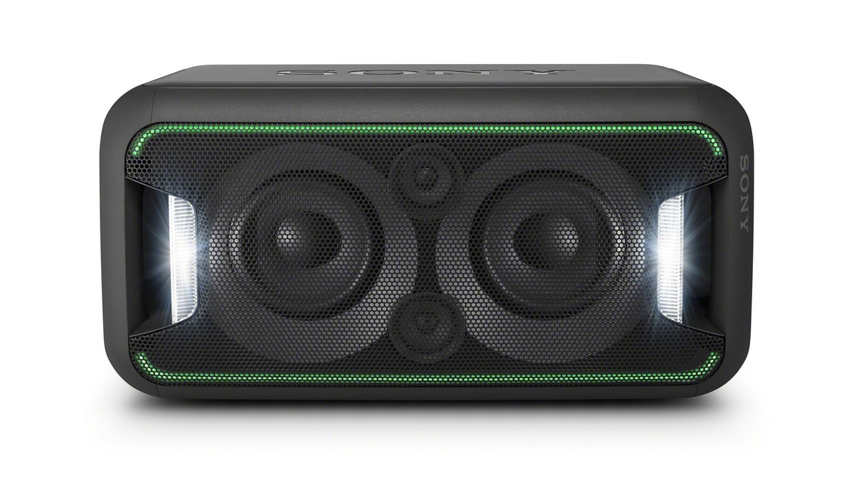 Altavoz Sony negro, vista frontal, con luces verdes y malla. Fondo blanco.