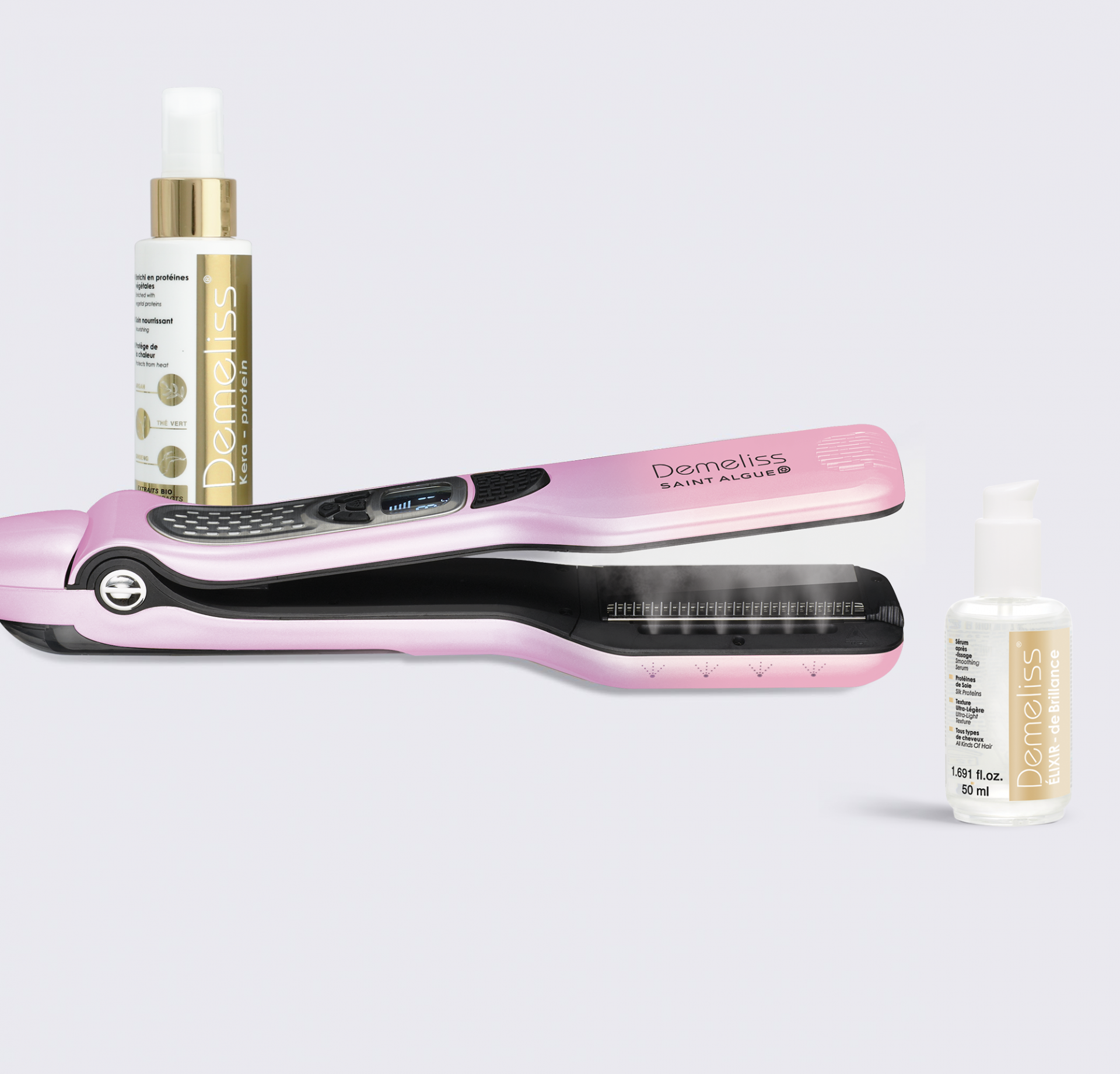 Pink hair straightener, two spray bottles, and a white surface.