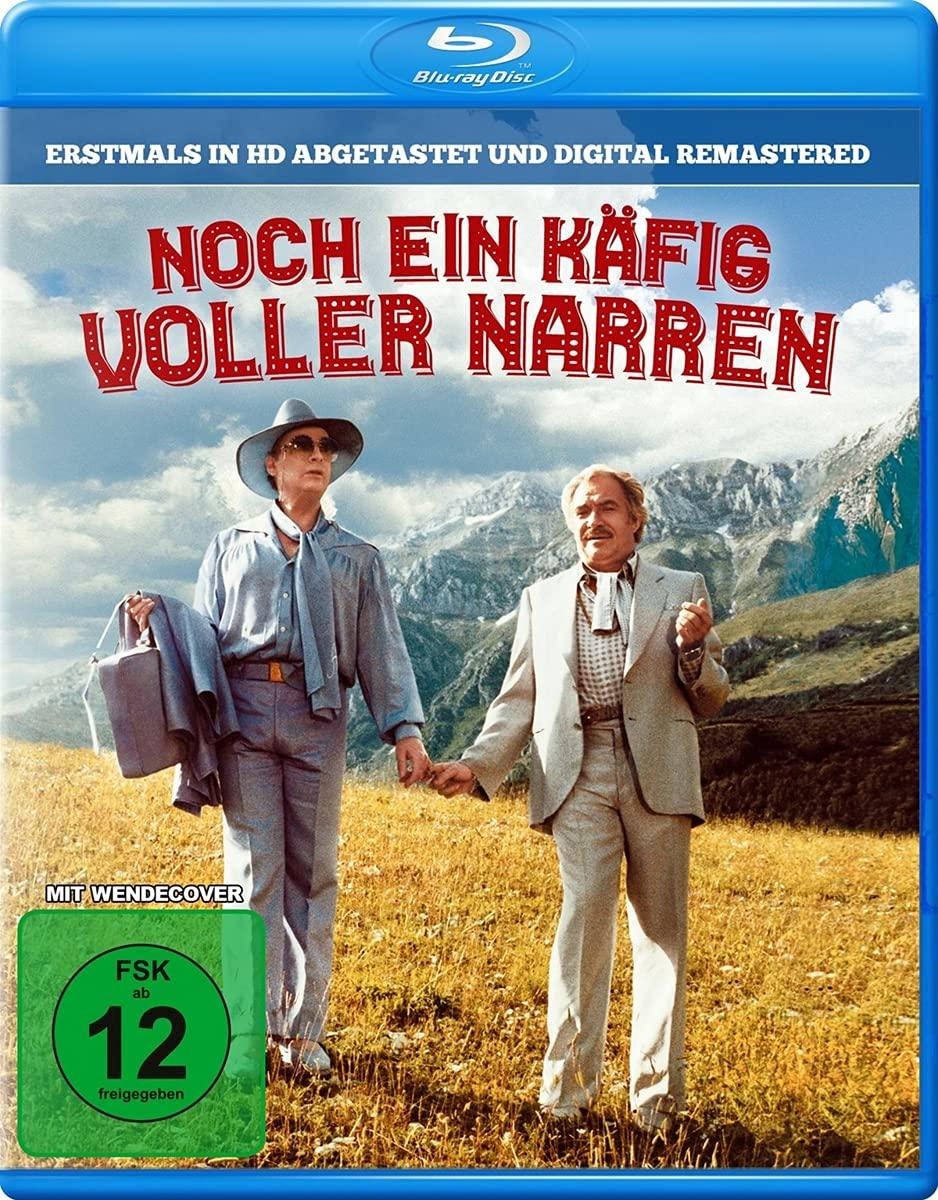 Blu-ray-Cover. Zwei Männer auf einem Feld, Berg-Hintergrund. Filmtitel in Rot und Weiß.